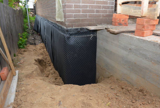 Happy homeowners after waterproofing job in Little Suamico